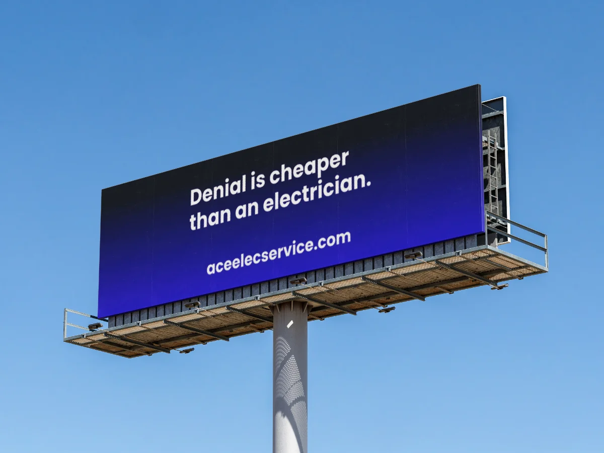 Billboard reading "Denial is cheaper than an electrician."