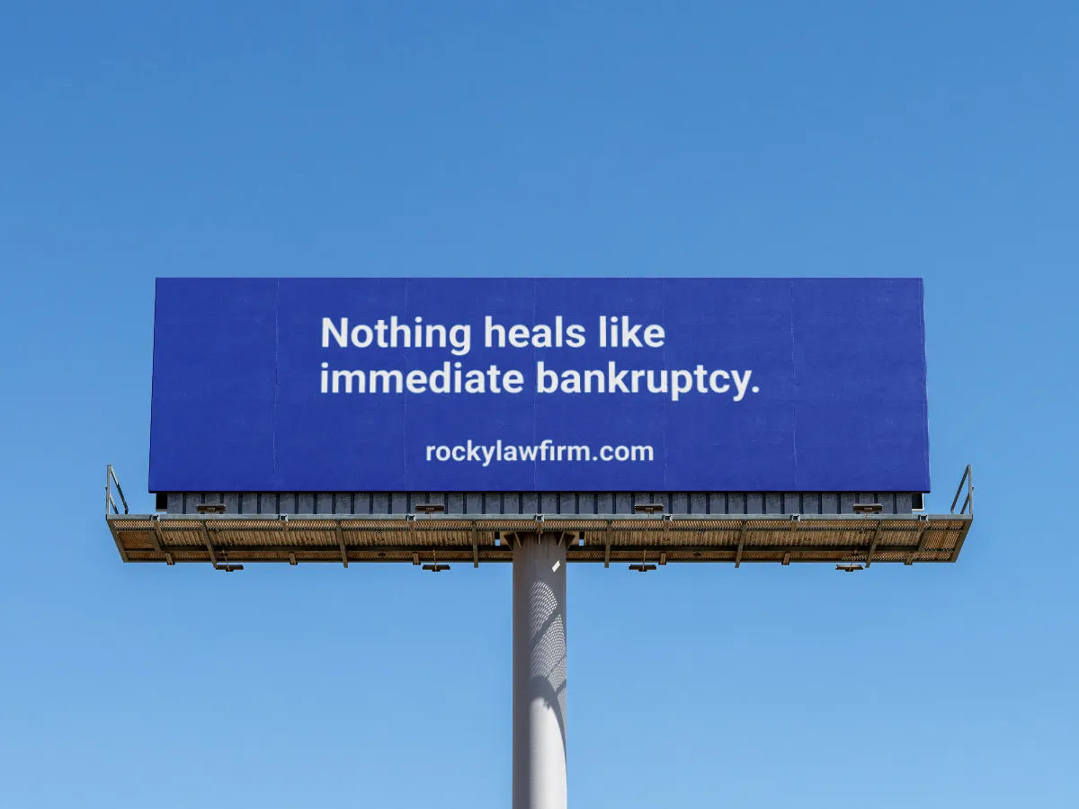 Billboard reading "Nothing heals like immediate bankruptcy."