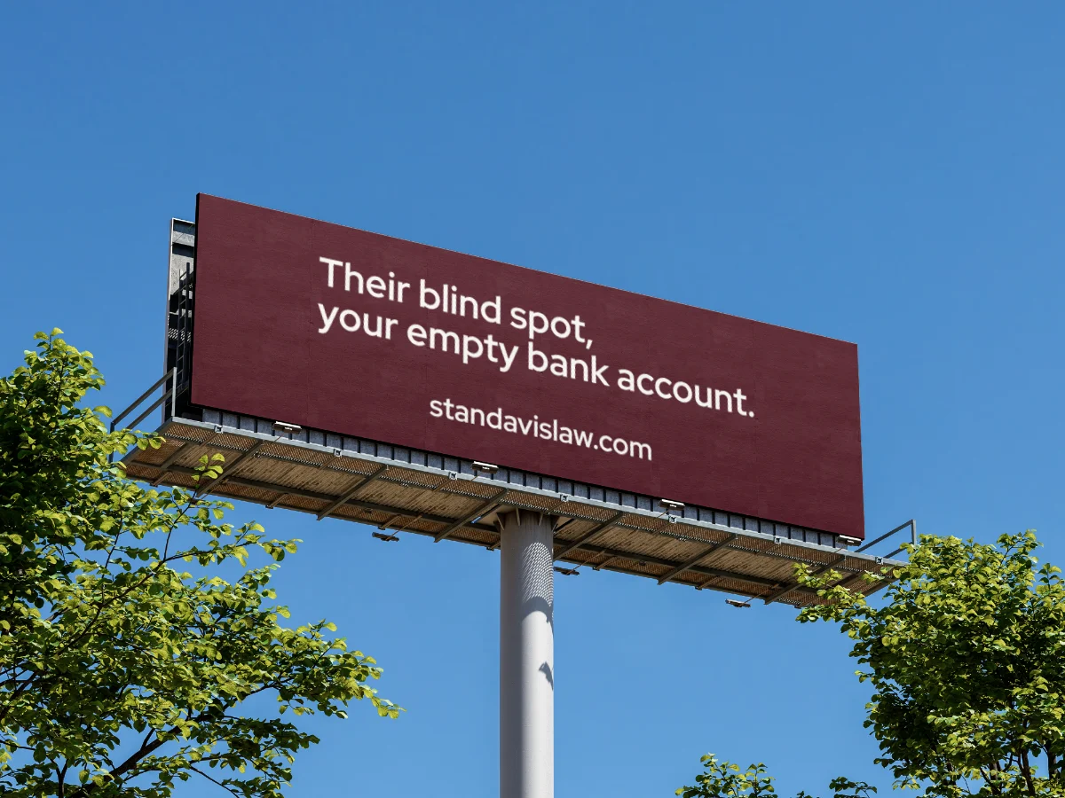 Billboard reading "Their blind spot, your empty bank account."